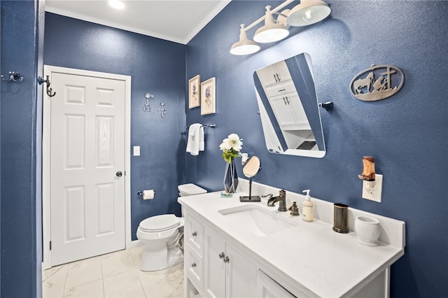 bathroom featuring vanity, marble finish floor, crown molding, and toilet