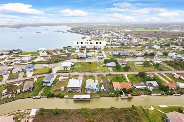 aerial view featuring a water view and a residential view