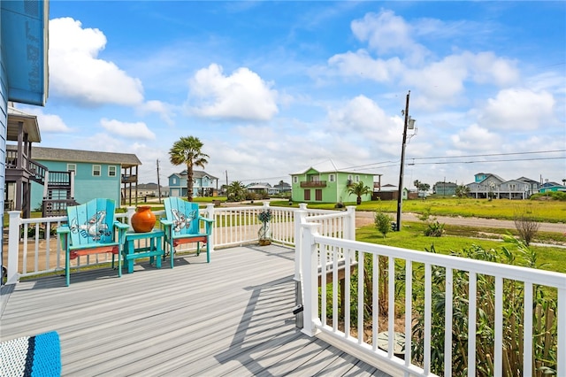 wooden deck featuring a residential view