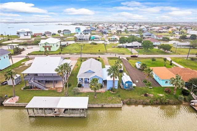 aerial view with a residential view and a water view