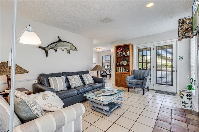 tiled living room with a textured ceiling