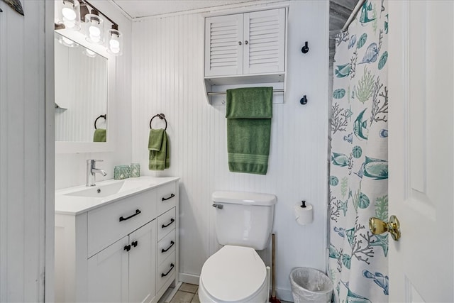 bathroom featuring curtained shower, vanity, and toilet