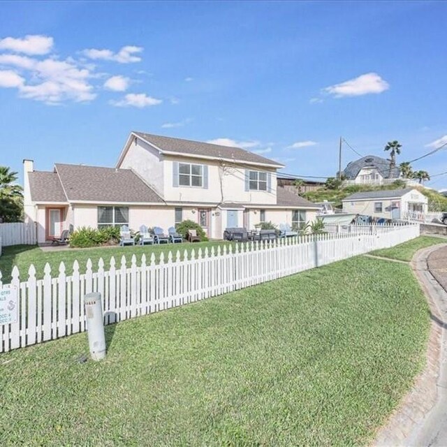 view of front of house with a patio and an outdoor living space