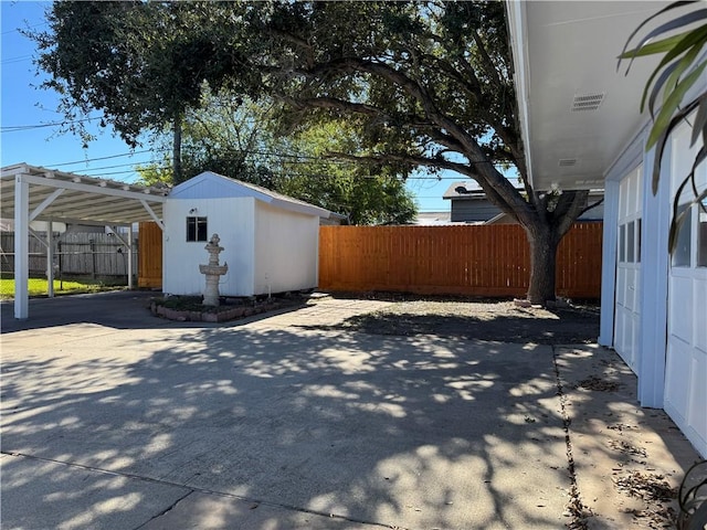 view of patio / terrace with a shed