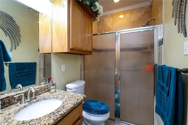 bathroom featuring toilet, walk in shower, and vanity