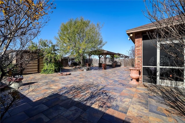 view of patio with an outdoor fire pit