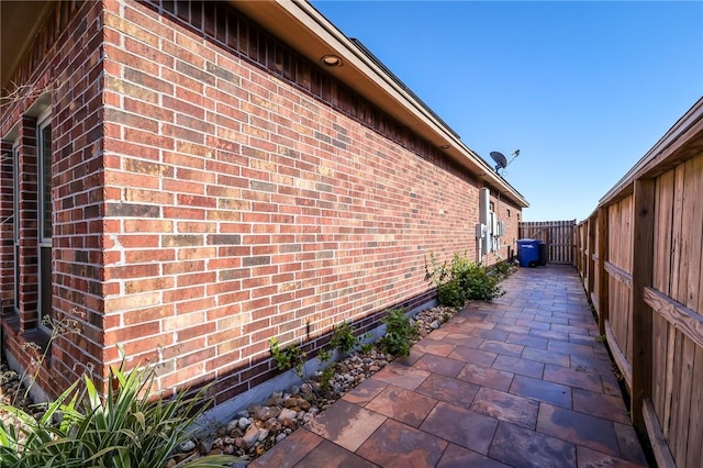 view of side of home featuring a patio