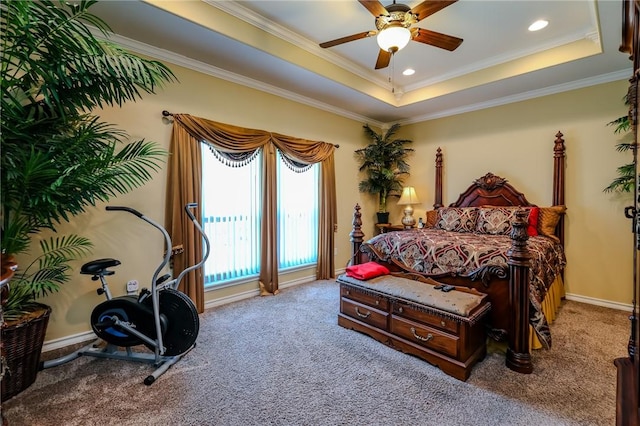 bedroom featuring ceiling fan, carpet, crown molding, and a raised ceiling