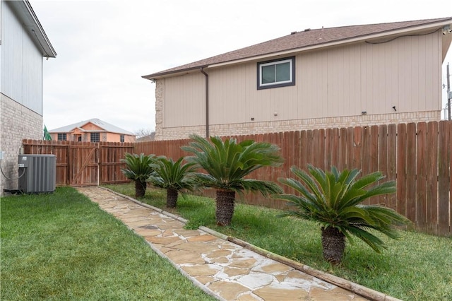 view of yard featuring central AC unit