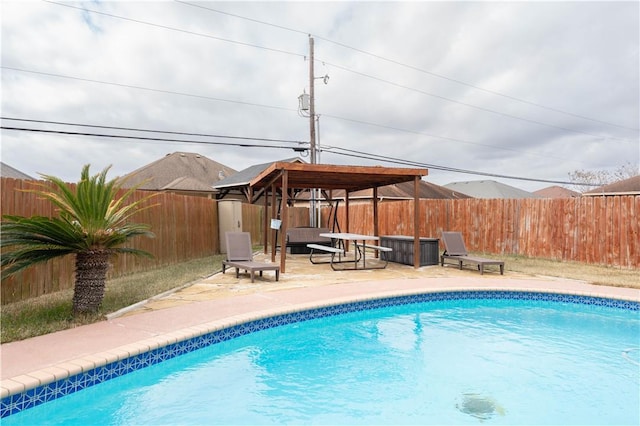 view of swimming pool with a gazebo and a patio area