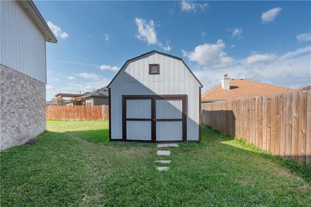 view of outdoor structure with a lawn