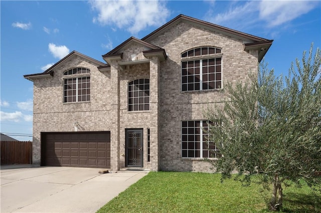 view of front of home featuring a garage and a front yard