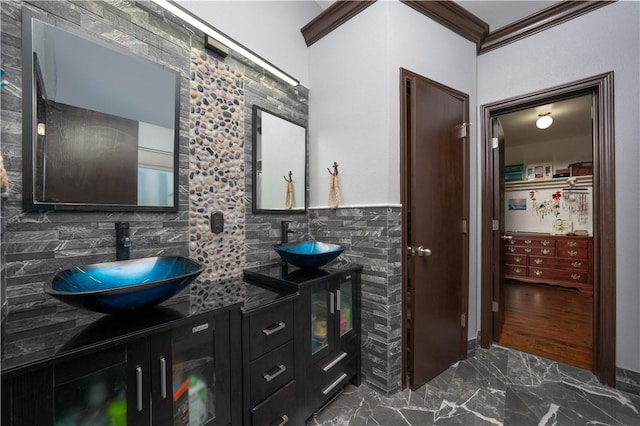 bathroom featuring vanity and ornamental molding