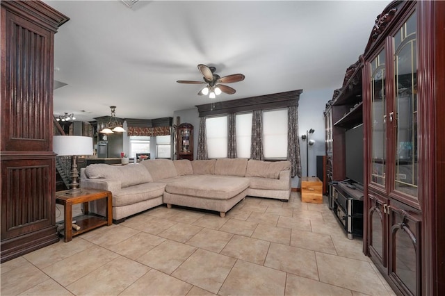 living room with light tile patterned flooring and ceiling fan