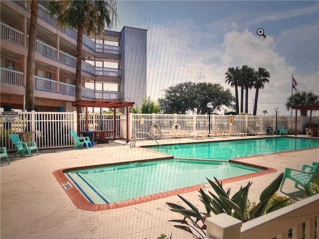 view of swimming pool featuring a patio