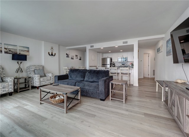 living room featuring light wood-type flooring