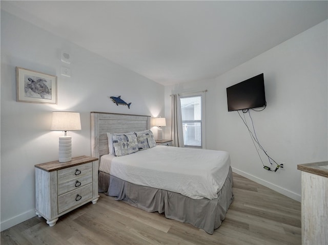 bedroom with light hardwood / wood-style floors