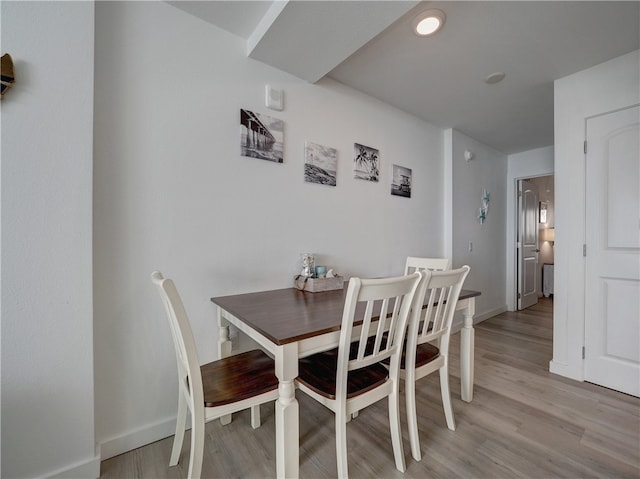 dining space with light wood-type flooring