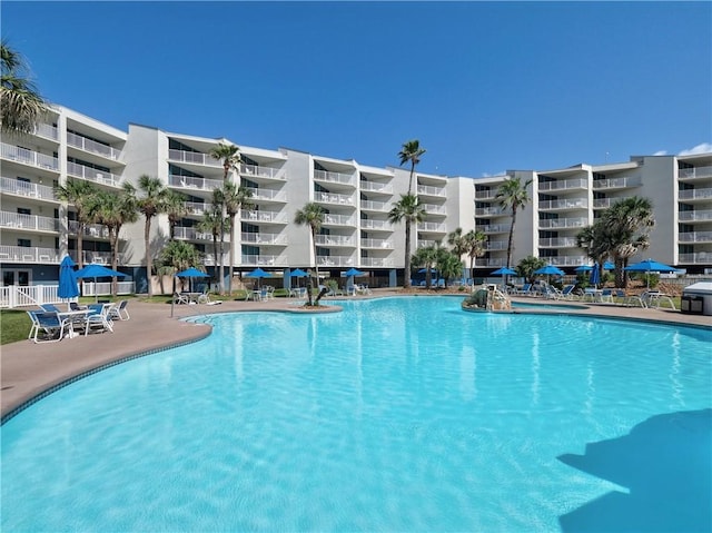 800 Sandcastle Dr Unit 513, Port Aransas, TX 78373 - community pool with a patio