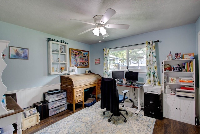 office space with a textured ceiling, dark hardwood / wood-style floors, and ceiling fan