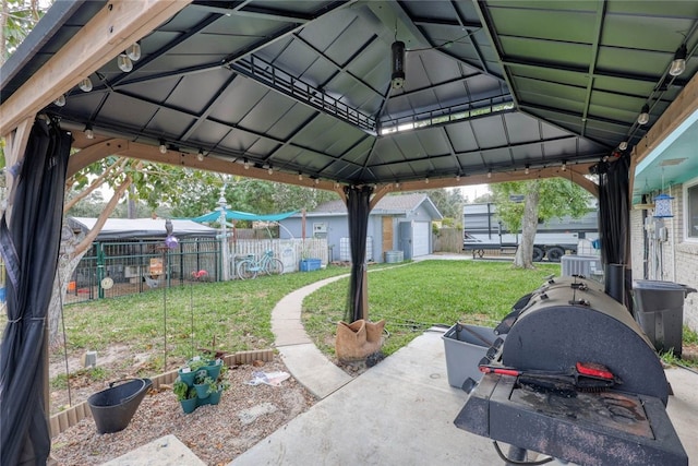 view of patio / terrace featuring a gazebo and an outdoor structure