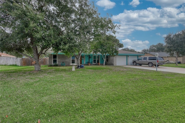 view of front of home featuring a garage and a front lawn