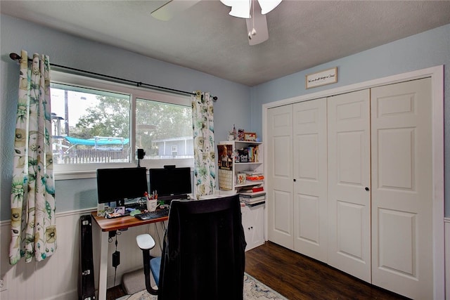 office area featuring a textured ceiling, ceiling fan, and dark hardwood / wood-style floors