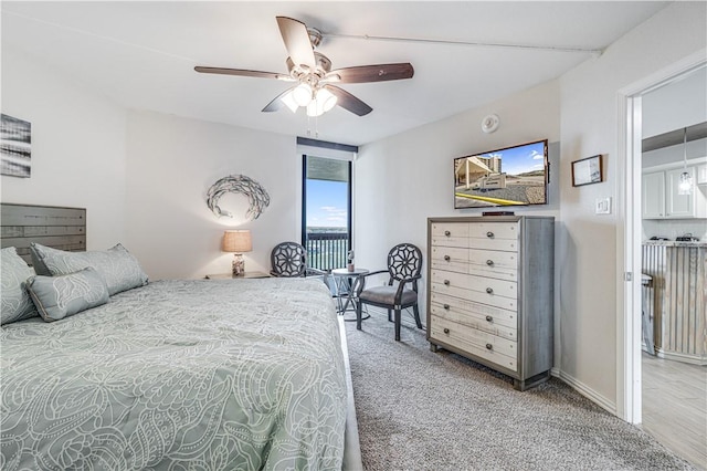 1000 Lantana Dr Unit 903, Port Aransas, TX 78373 - bedroom featuring access to outside, ceiling fan, and carpet flooring