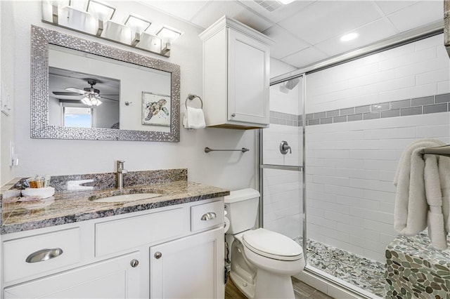 1000 Lantana Dr Unit 903, Port Aransas, TX 78373 - bathroom with a shower stall, toilet, vanity, and ceiling fan