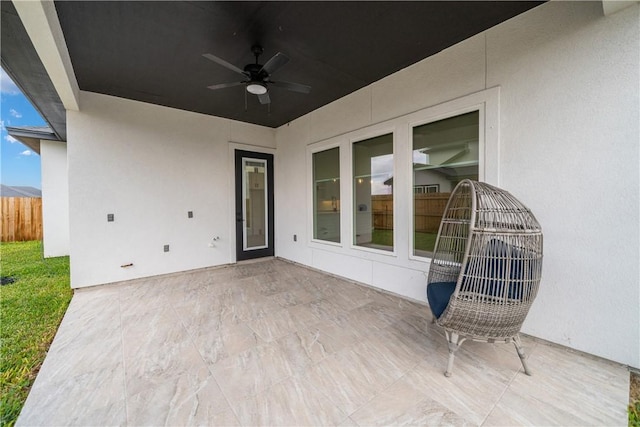 view of patio / terrace featuring ceiling fan