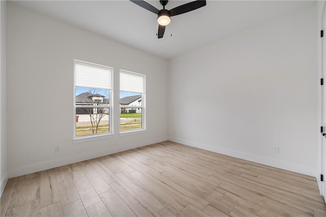 empty room featuring light hardwood / wood-style floors and ceiling fan