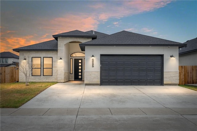 prairie-style home featuring a garage