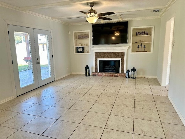 unfurnished living room with french doors, light tile patterned floors, and built in shelves