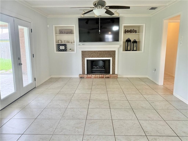 722 Meadowbrook, Corpus Christi, TX 78412 - unfurnished living room featuring built in shelves, ornamental molding, healthy amount of natural light, light tile patterned floors, and a ceiling fan