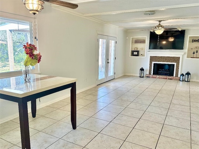 unfurnished living room with french doors, light tile patterned floors, ceiling fan, and built in shelves