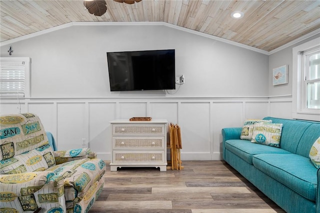 living area featuring ornamental molding, wooden ceiling, vaulted ceiling, and light wood-style flooring