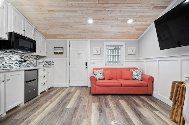 living room featuring wooden ceiling, crown molding, and wood finished floors