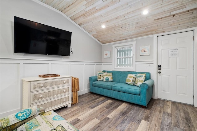 living room featuring a wainscoted wall, crown molding, wood ceiling, vaulted ceiling, and wood finished floors