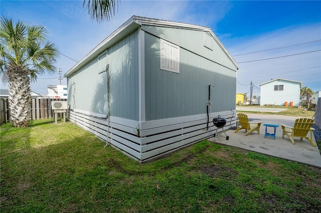 view of outbuilding with fence