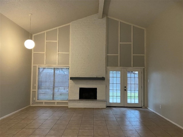 unfurnished living room with french doors, a fireplace, a textured ceiling, beamed ceiling, and tile patterned flooring