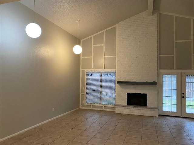 unfurnished living room with built in shelves, a textured ceiling, a fireplace, tile patterned flooring, and lofted ceiling