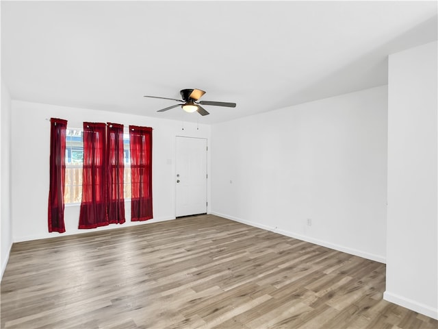 unfurnished room with ceiling fan and light hardwood / wood-style floors