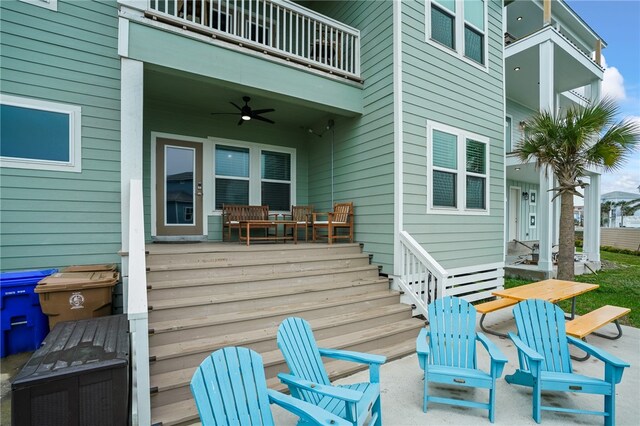 view of patio / terrace featuring ceiling fan and a balcony