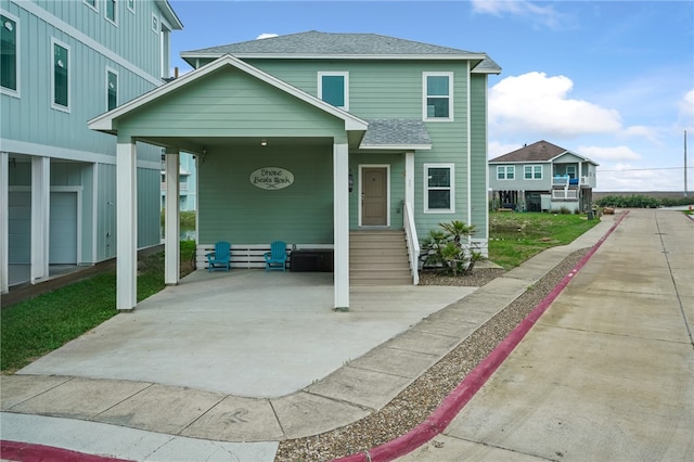 view of front facade with a carport