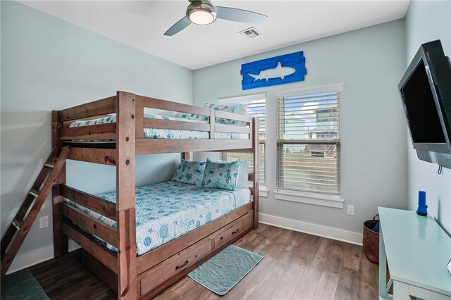 bedroom featuring hardwood / wood-style floors and ceiling fan