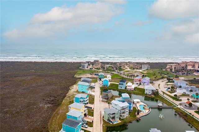 aerial view featuring a view of the beach and a water view