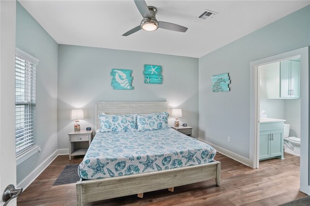 bedroom featuring wood-type flooring, ceiling fan, and connected bathroom