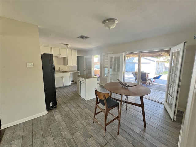 dining space featuring wood-type flooring