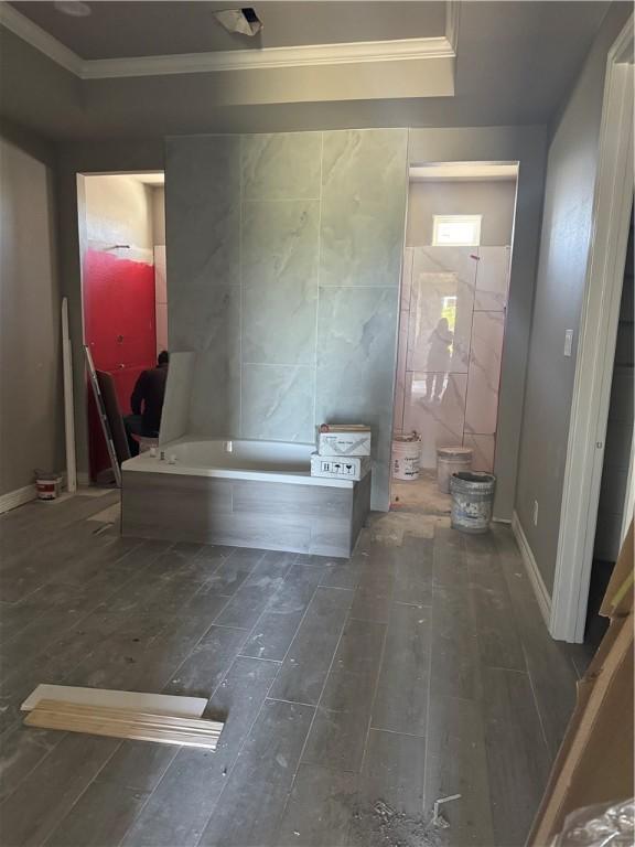 2110 Sera, Corpus Christi, TX 78418 - full bath with crown molding, hardwood / wood-style flooring, a bath, a raised ceiling, and tile walls