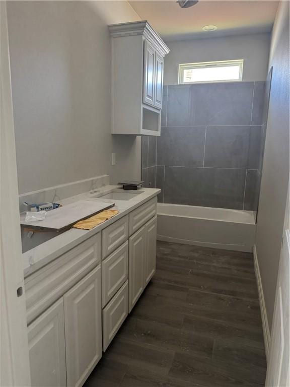 2110 Sera, Corpus Christi, TX 78418 - bathroom featuring double vanity, wood finished floors, and shower / washtub combination